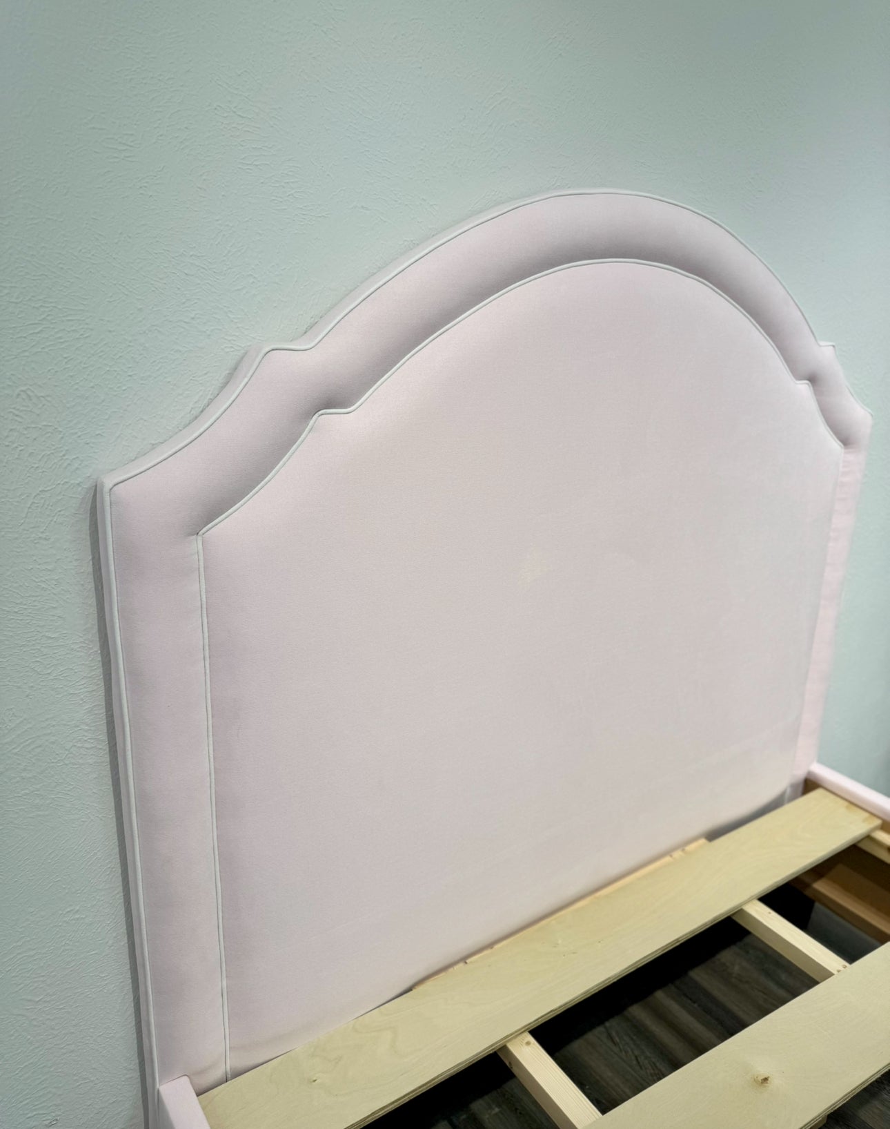 60”H Queen Upholstered Platform Bed - Scalloped Base - Powder Pink Woven Fabric with White Pink