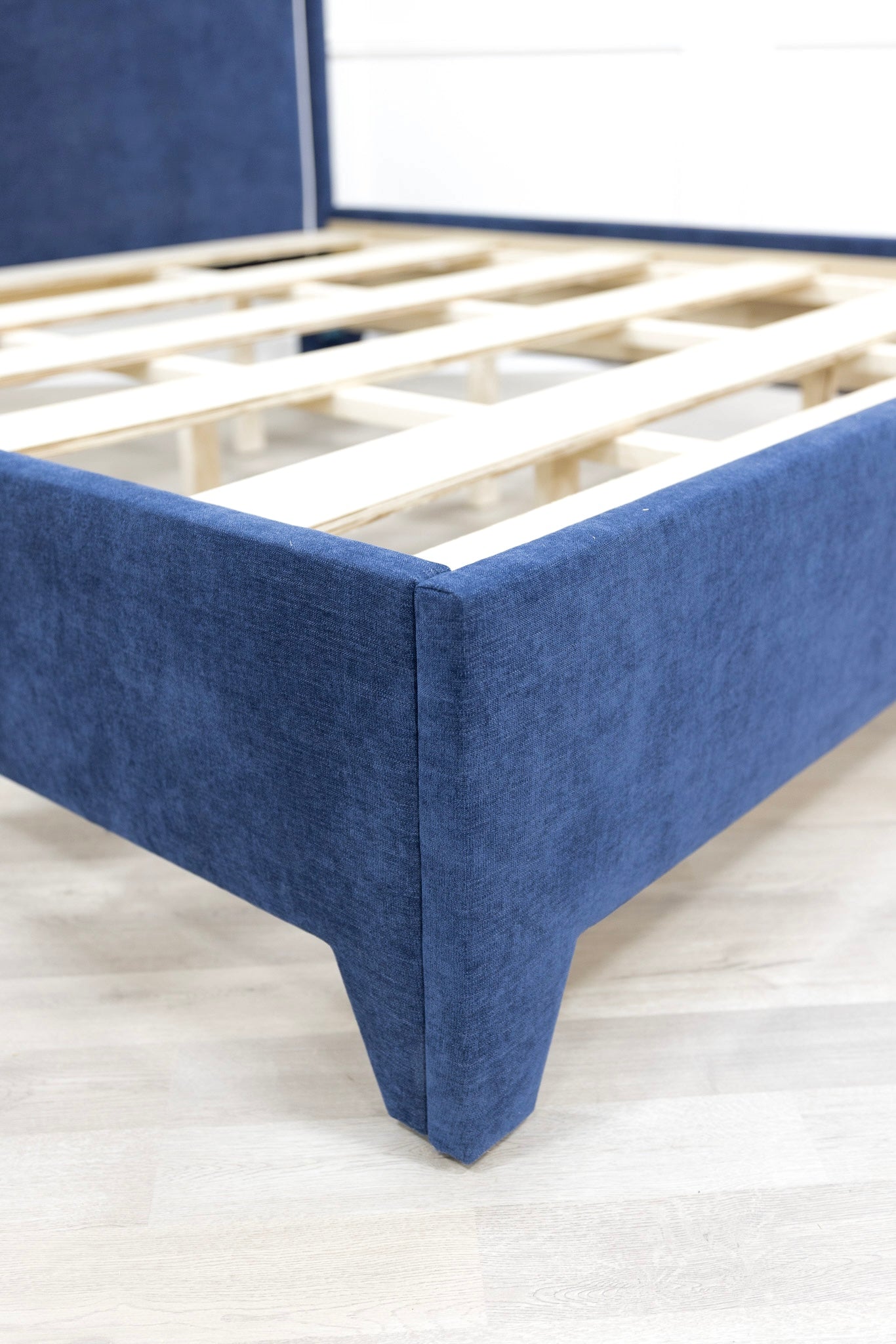 The Martha King Platform Bed - Upholstered Legs - Crypton Fabric in Navy Blue - White Trim