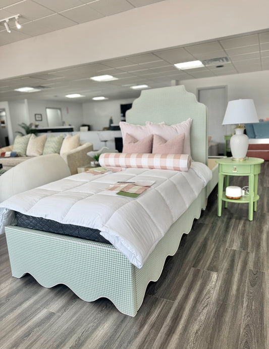 Twin scalloped platform bed.